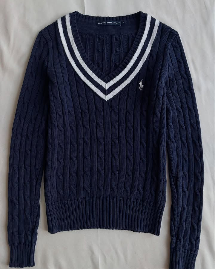 Navy blue v-neck knit sweater with white stripes