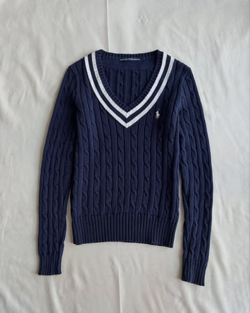 Navy blue v-neck knit sweater with white stripes