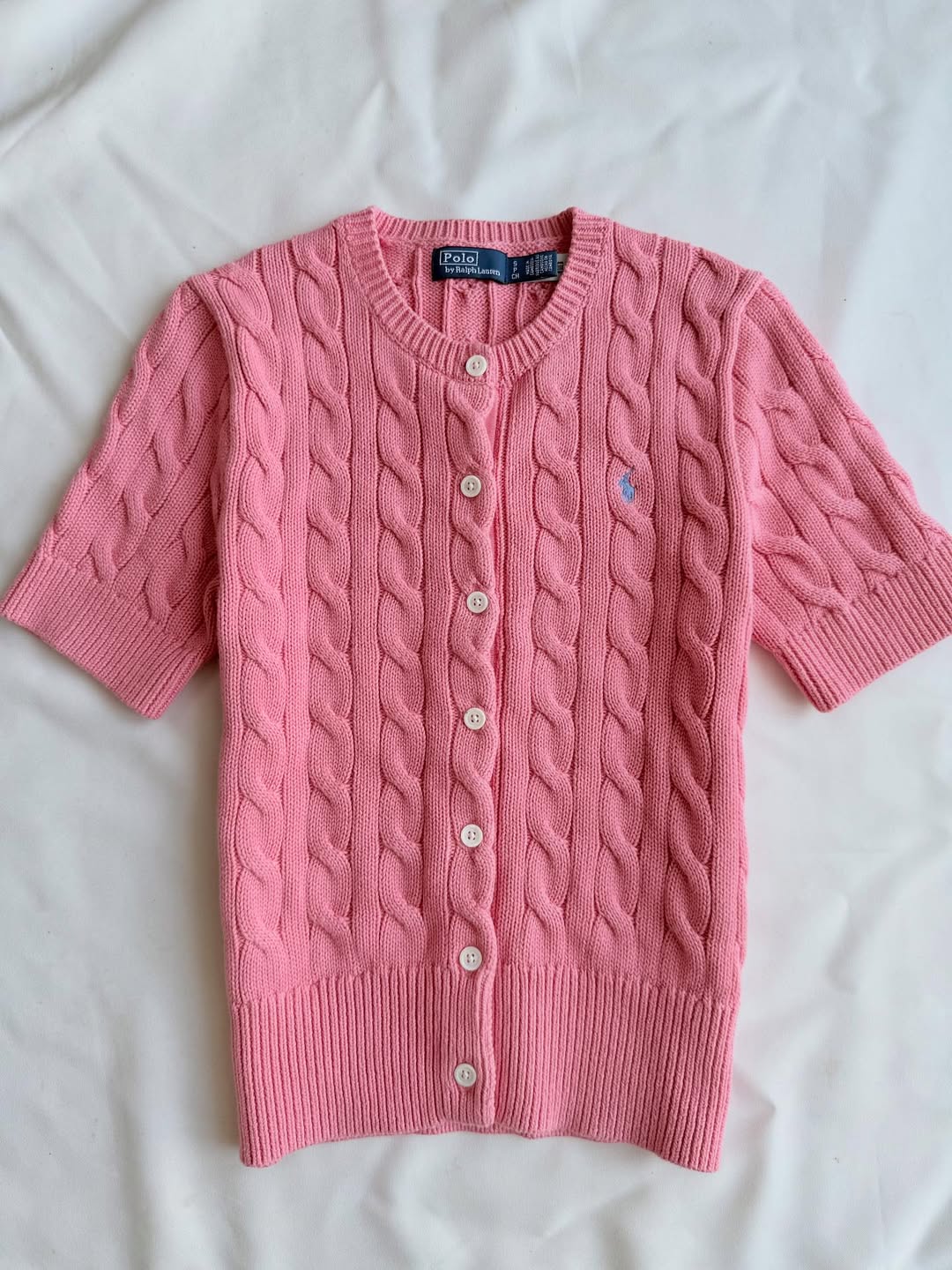 Pink short-sleeve knit blouse